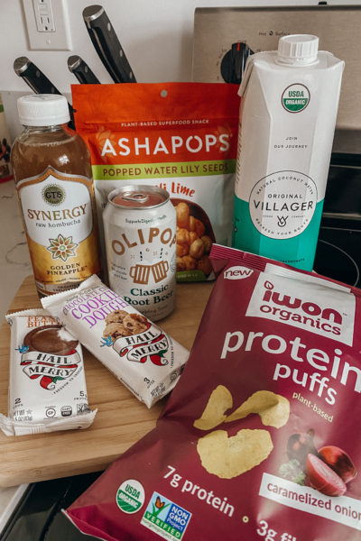 grocery haul with group oof healthy snacks and drinks like kombucha chips coconut water dessert and chips