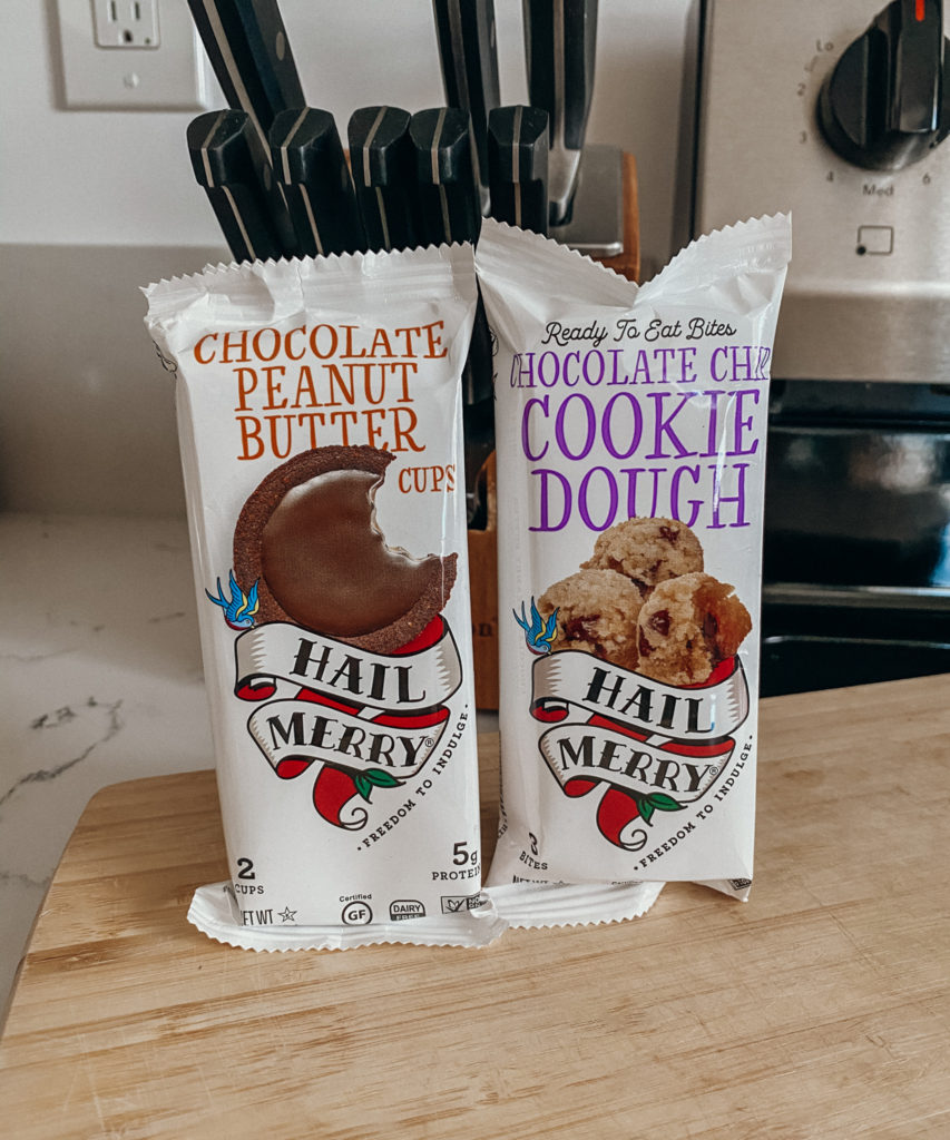 hail merry chocolate peanut butter cups and ready to eat cookie dough bites sitting on a kitchen counter displayed